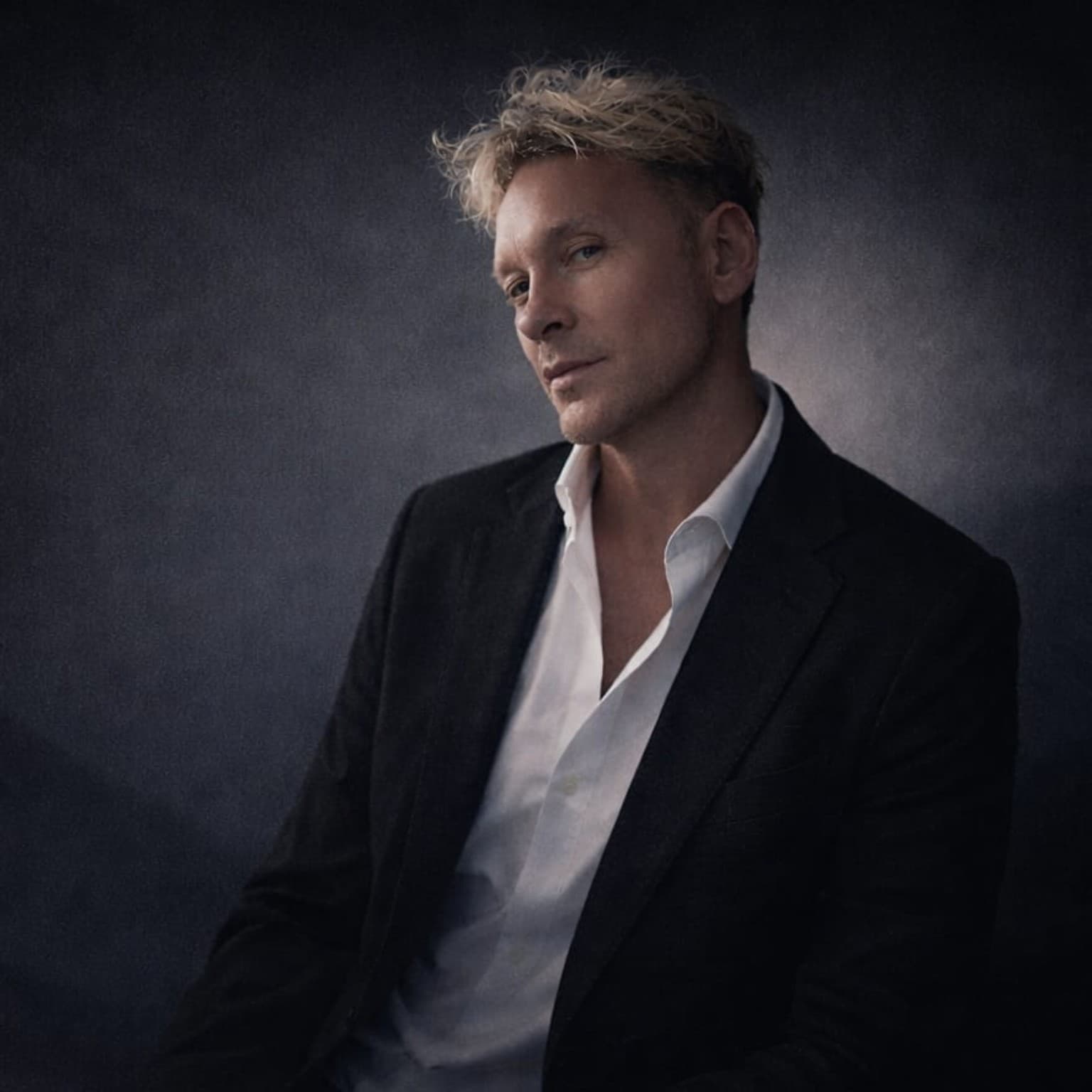 Tim Lord seated in the studio